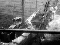 Parker is offloaded onto Moreau's boat
